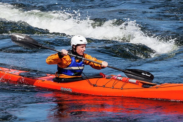 A sea kayaker at the Falls of Lora at Connel in Scotland
