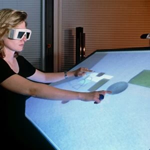 Woman using a 3-D computer-aided design system