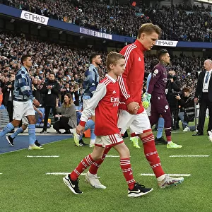 Arsenal's Martin Odegaard and Mascot Before Manchester City Clash - Premier League 2022-23
