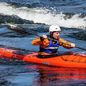 A sea kayaker at the Falls of Lora at Connel in Scotland