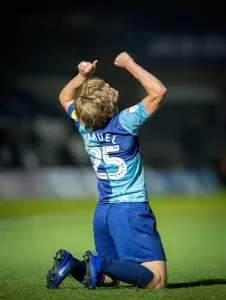 Alex Samuel celebrates