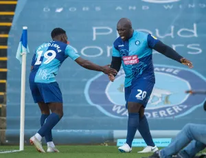 Fred Onyedinma celebrates with Adebayo Akinfenwa